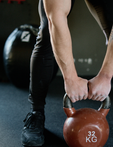 arms and a sports kettlebell