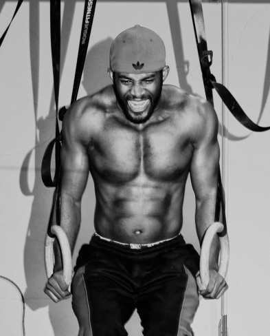 a strong man pulls himself up by his arms